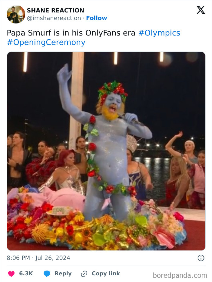 Olympics sex meme: "Papa Smurf is in his OnlyFans era" - blue man as Bacchus surrounded by fruit during Paris Olympics Opening Ceremony