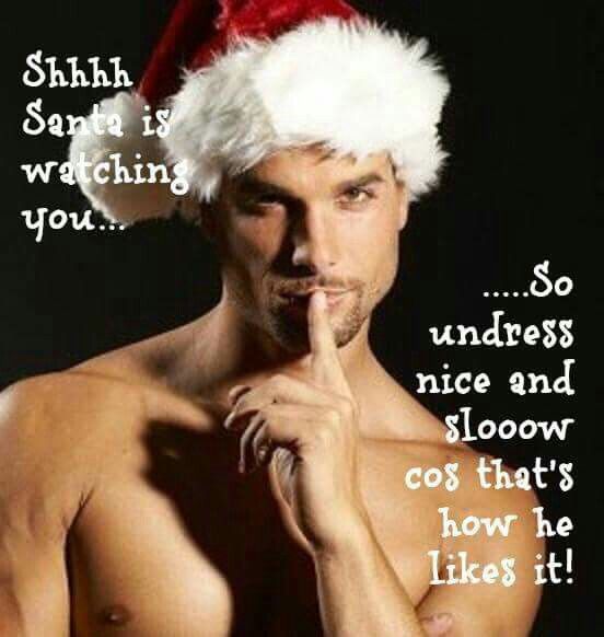 Sssh. Santa is watching you, so undress nice and slow coz that's how he likes it. Sexy guy wearing a Santa hat