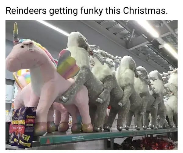 Reindeers getting funky this Christmas: toy reindeers mounting a pink unicorn